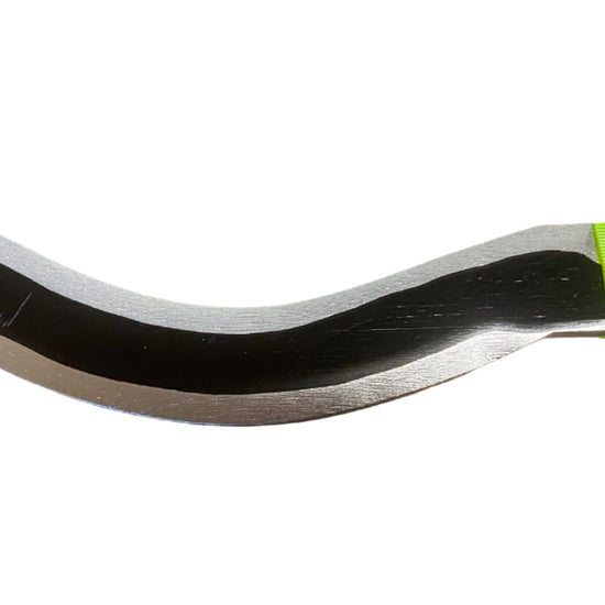 Close-up of a curved metal rod with a green label on a white background