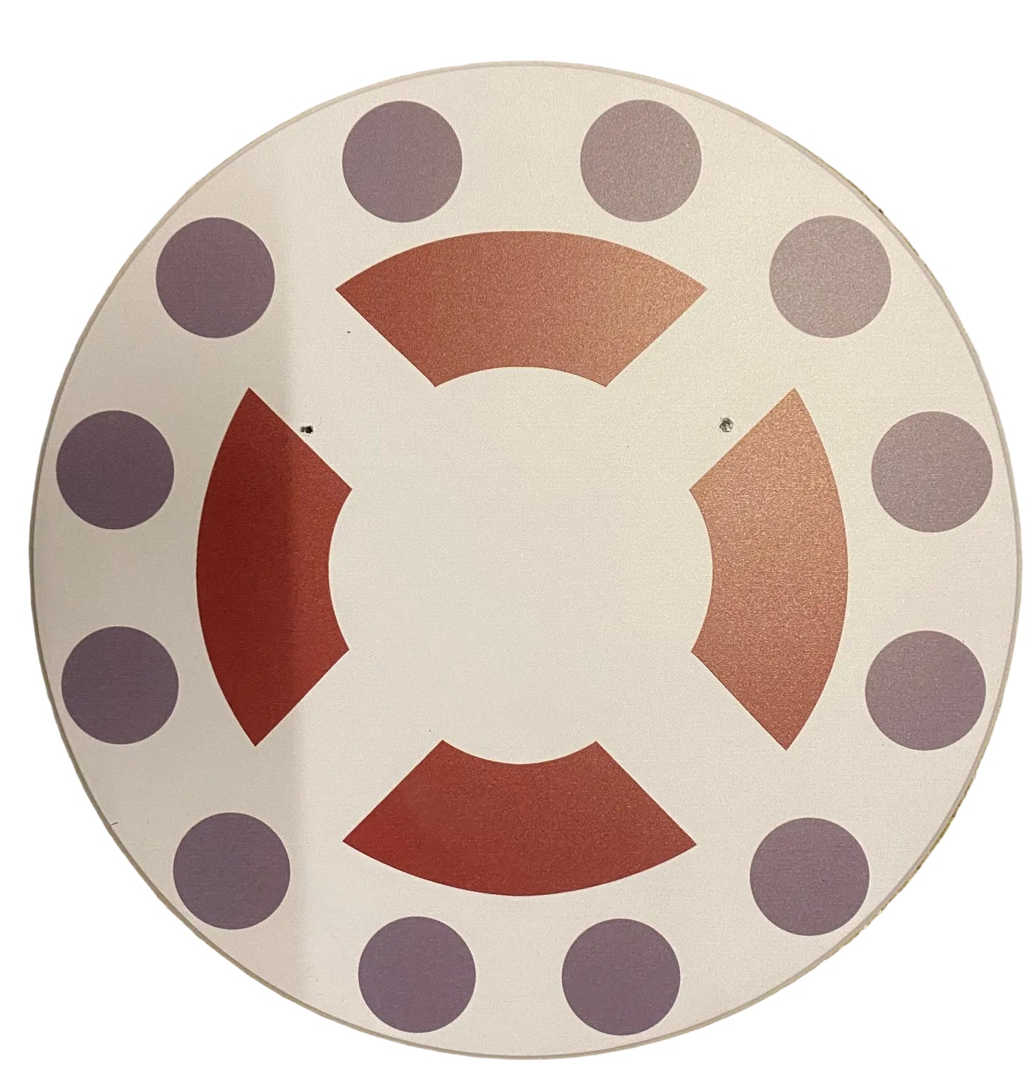 Decorative plate with purple polka dots and red geometric shapes on a beige background