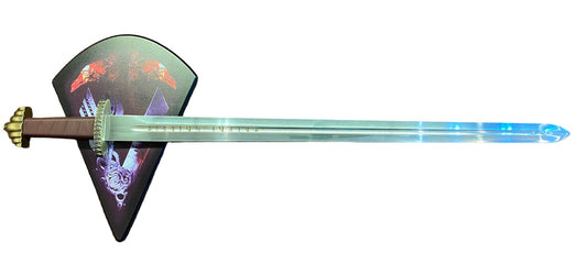 Long sword with decorative sheath on a brown surface