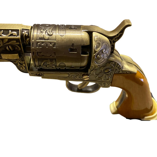 Decorative revolver on a stand with intricate details