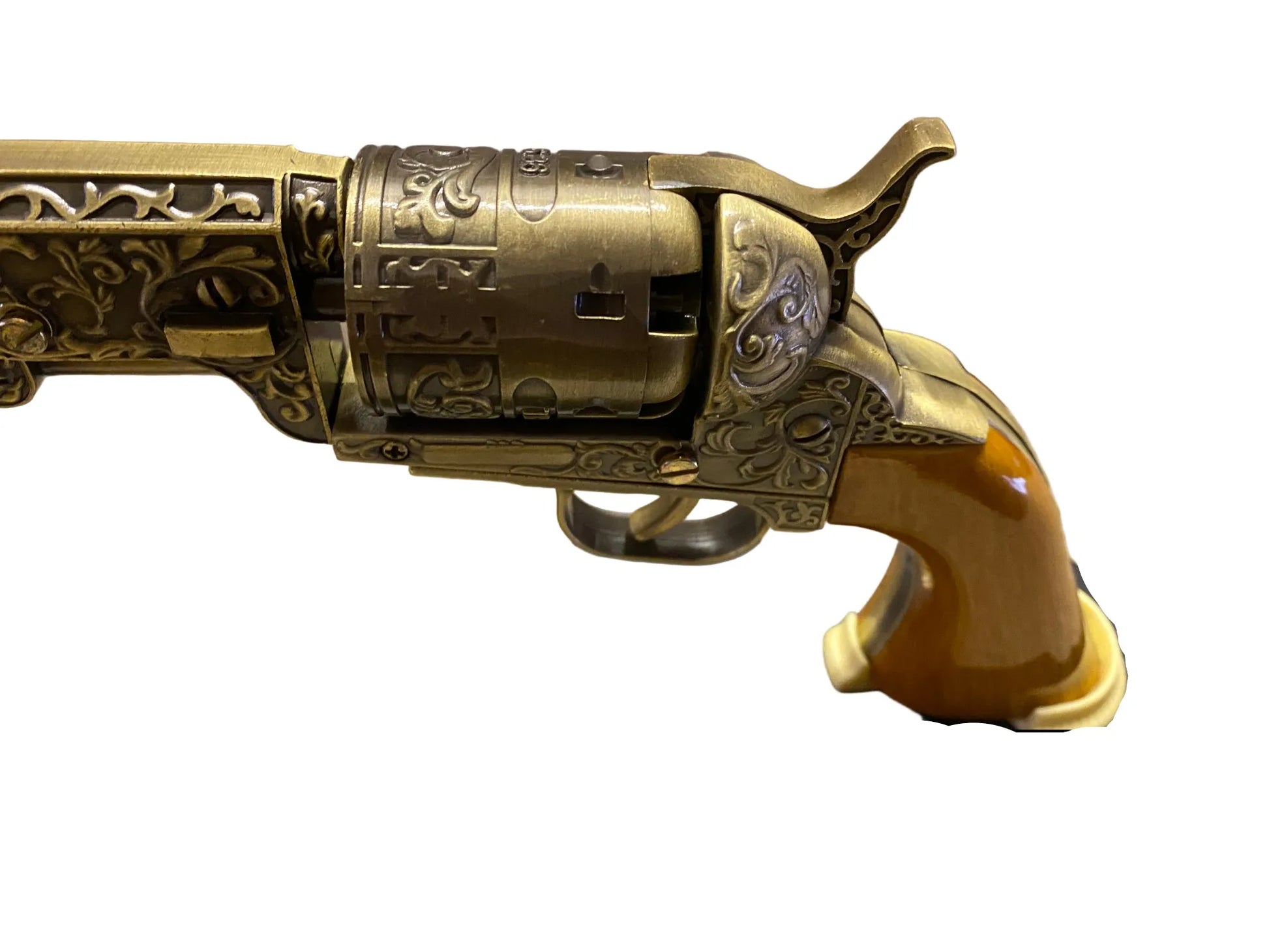 Decorative revolver on a stand with intricate details