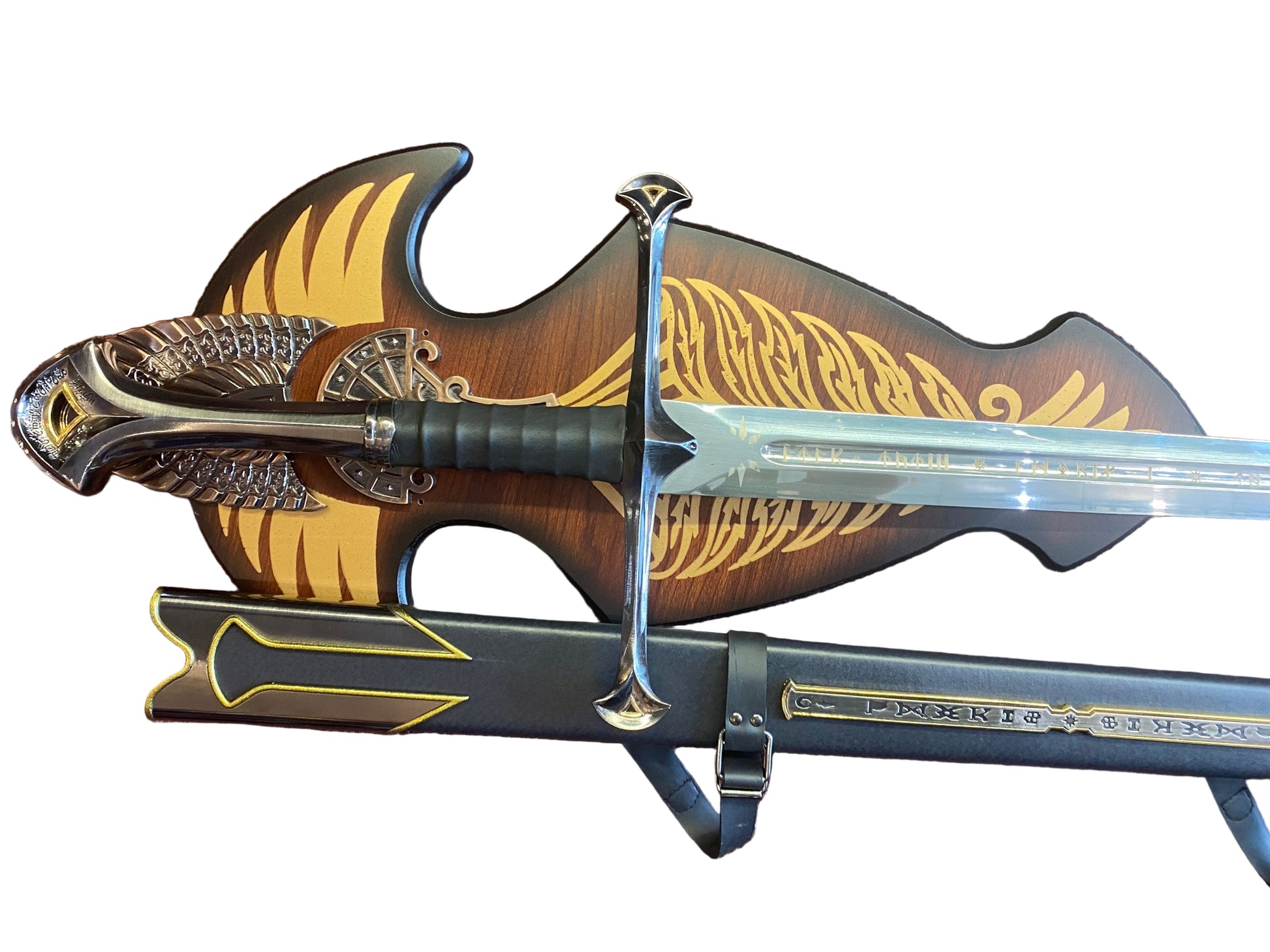 Decorative sword with ornate handle and sheath on a textured surface