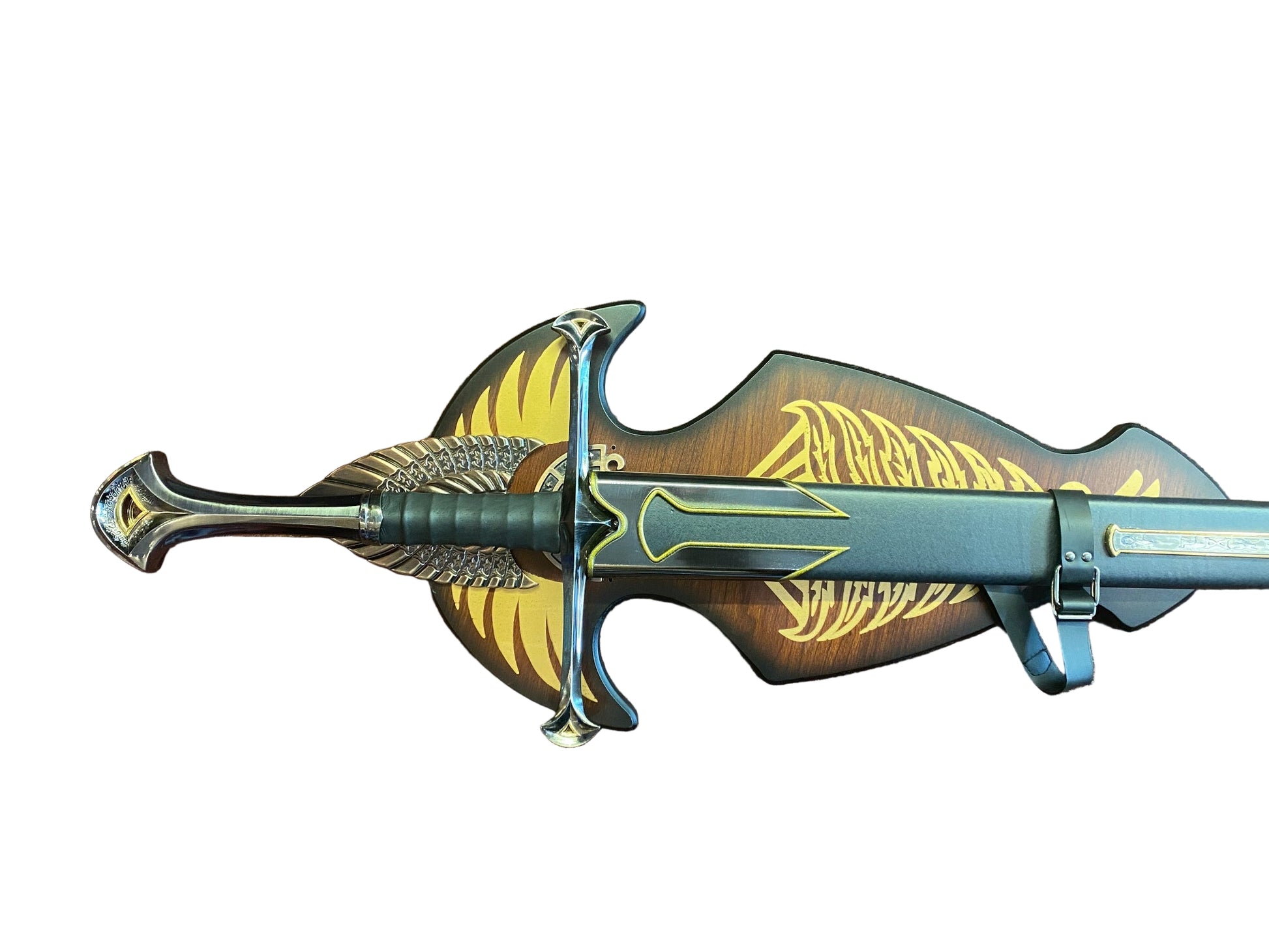 Decorative sword with gold and black design on a brown textured background