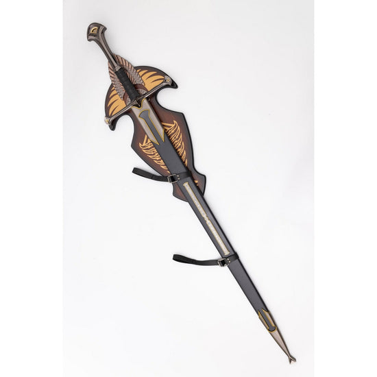 Decorative sword with ornate handle on a white background