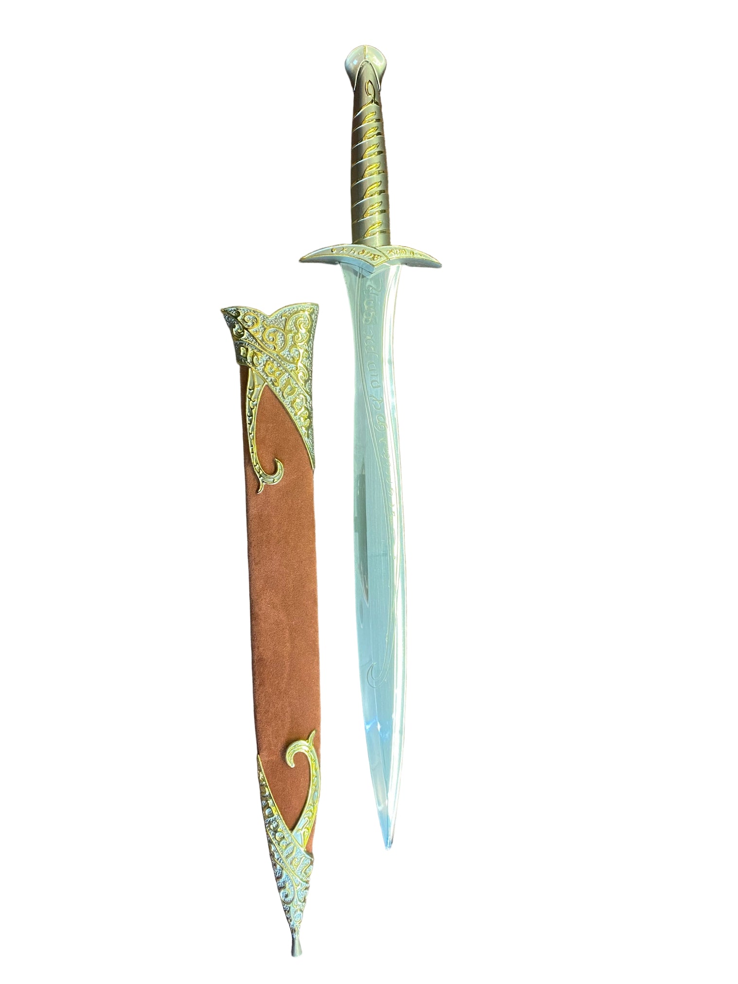 Decorative dagger with ornate handle on a brown textured surface