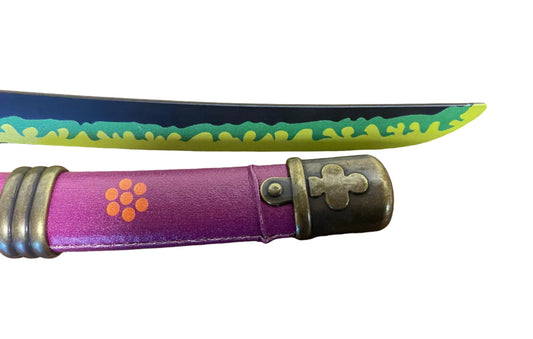Purple folding knife with floral design on a brown surface