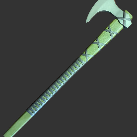 Green axe with a textured handle on a brown surface