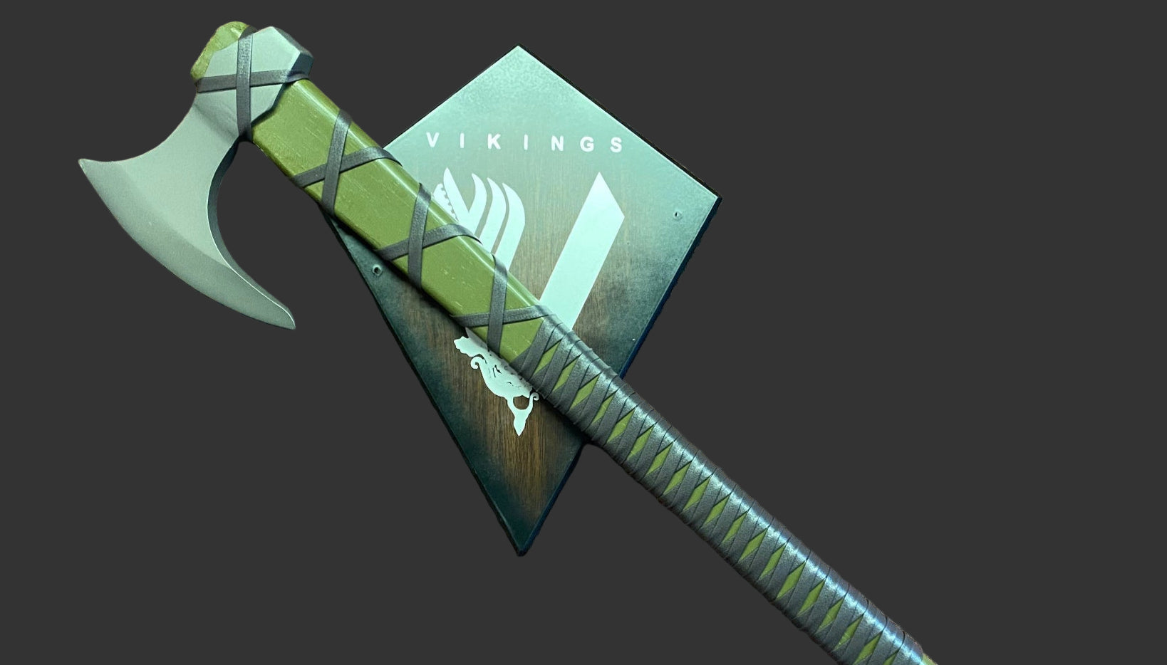 Green axe with a sheath on a brown textured surface