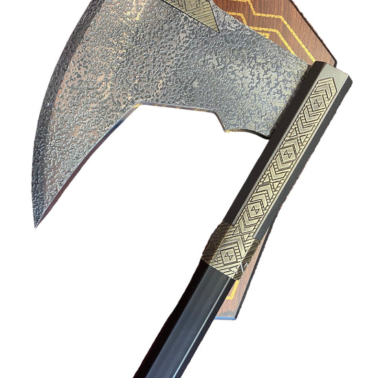 Decorative axe with a wooden handle on a white background