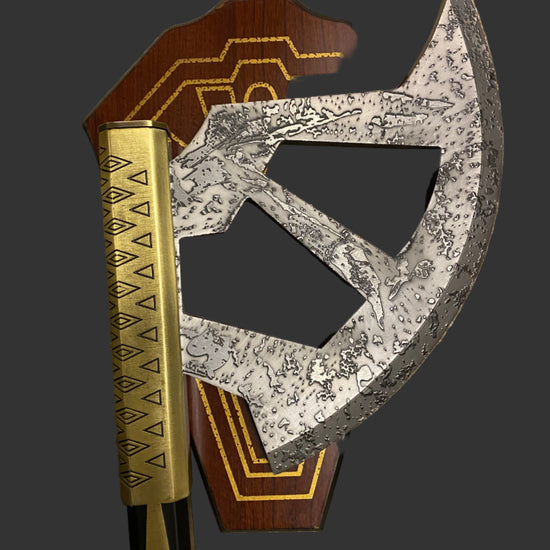 Decorative axe with wooden handle and metallic blade on a dark background