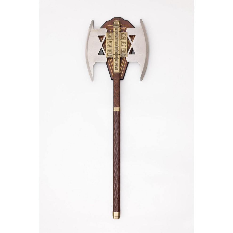 Decorative axe with a wooden handle and metallic head on a white background