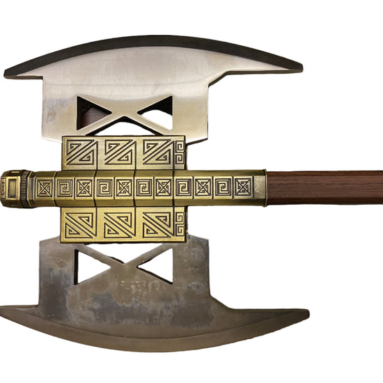 Decorative axe with gold and silver design on a white background