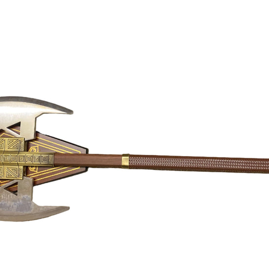 Decorative axe with a detailed head and wooden handle on a white background