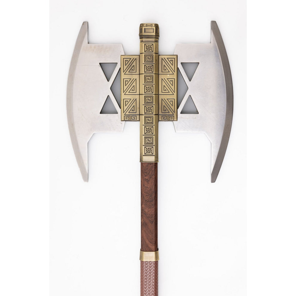 Decorative axe with a wooden handle and gold decorative blade on a white background