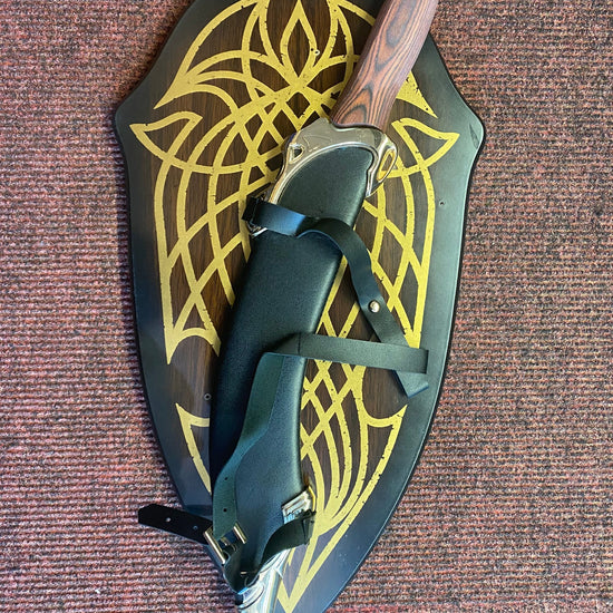 Decorative sheath with a knife on a textured surface