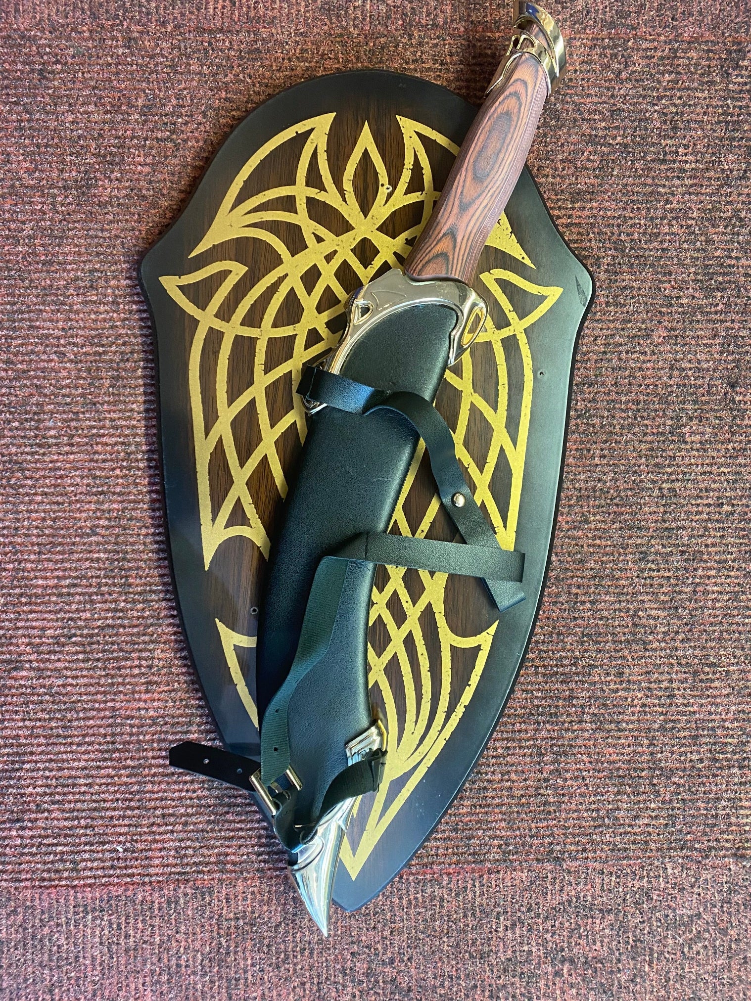 Decorative sheath with a knife on a textured surface