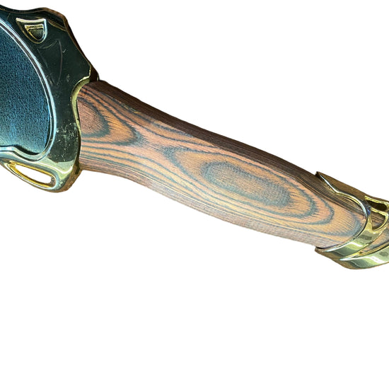 Wooden handle with gold accents on a textured brown surface