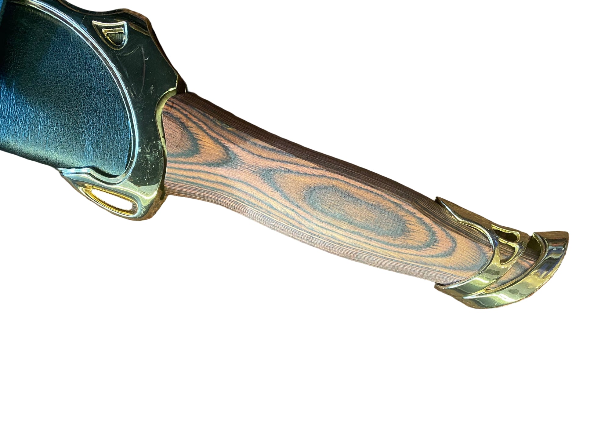 Wooden handle with gold accents on a textured brown surface