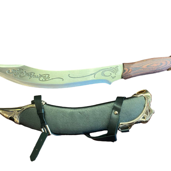Decorative knife with a sheath on a textured surface