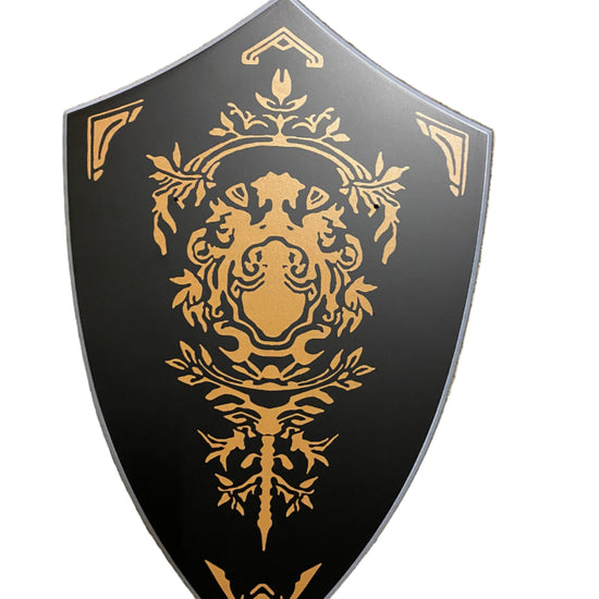 Decorative shield with gold emblem on a black background