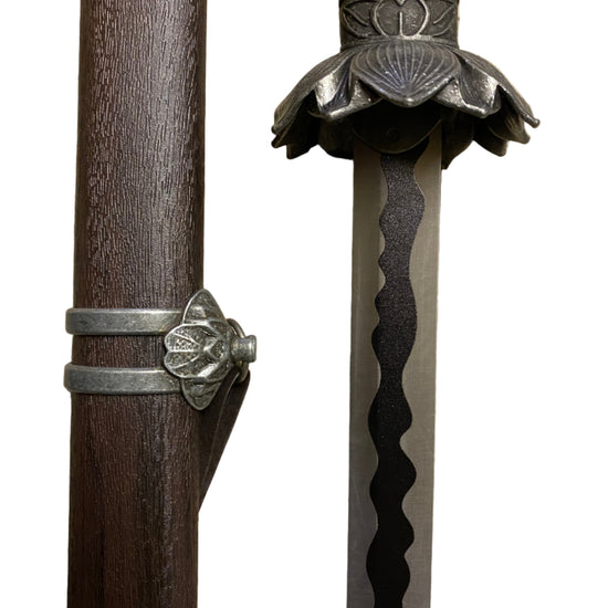 Sword with decorative hilt on a white background