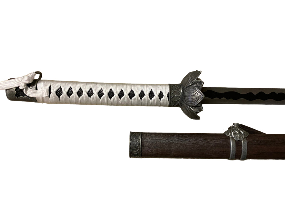 Sword with decorative sheath on a white background