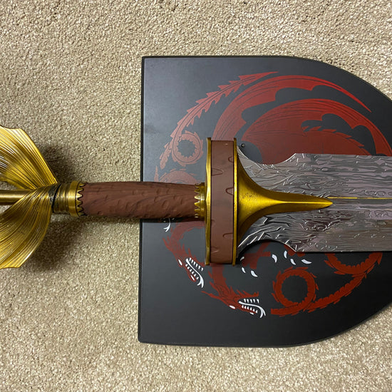 Decorative sword with gold and brown handle 