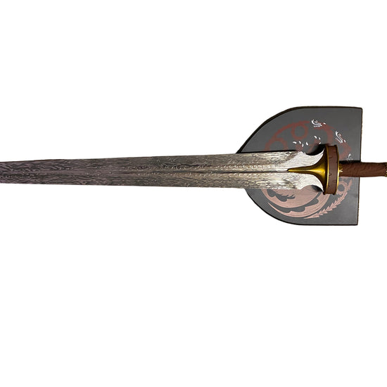 Decorative sword with a gold hilt on a white background