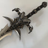 Decorative axe with intricate design on a white background