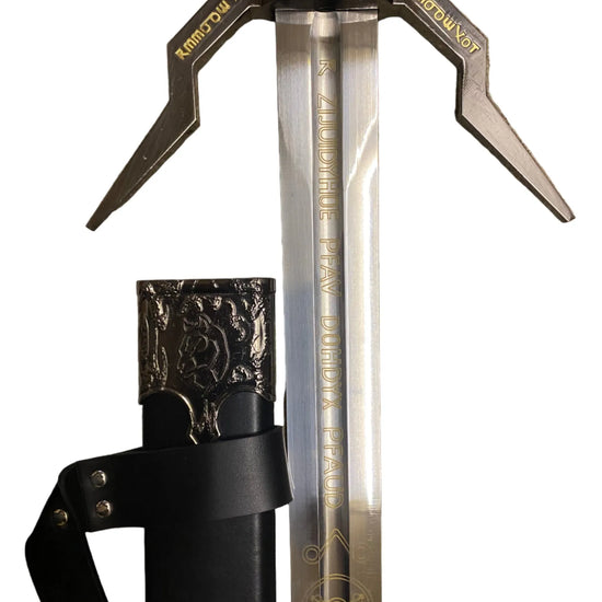 Sword with decorative head and black sheath on a white background