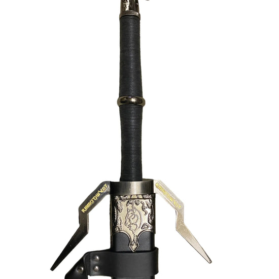 Sword with decorative hilt on a white surface