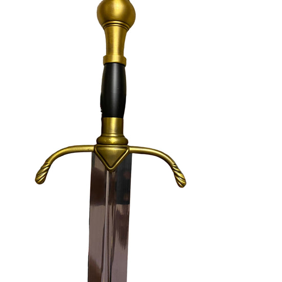 Decorative sword with gold hilt and black handle on a white background