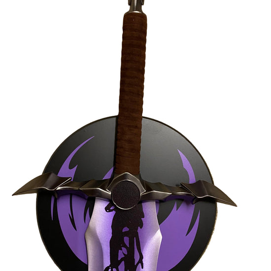 Decorative weapon with a brown handle and metallic blade on a white background
