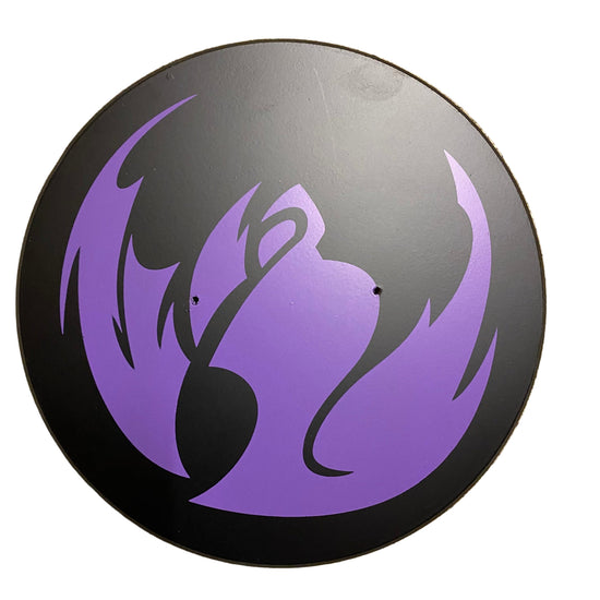 Round black object with purple flame-like design on a white background