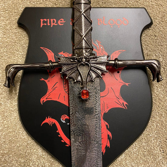 Decorative axe with dragon design and 'Fire' text on a beige background