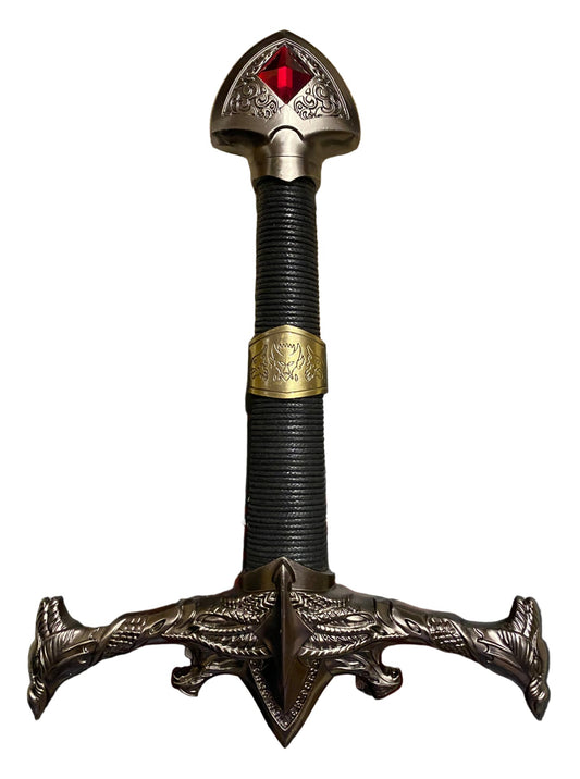 Decorative sword with a detailed hilt and red gem on a white background