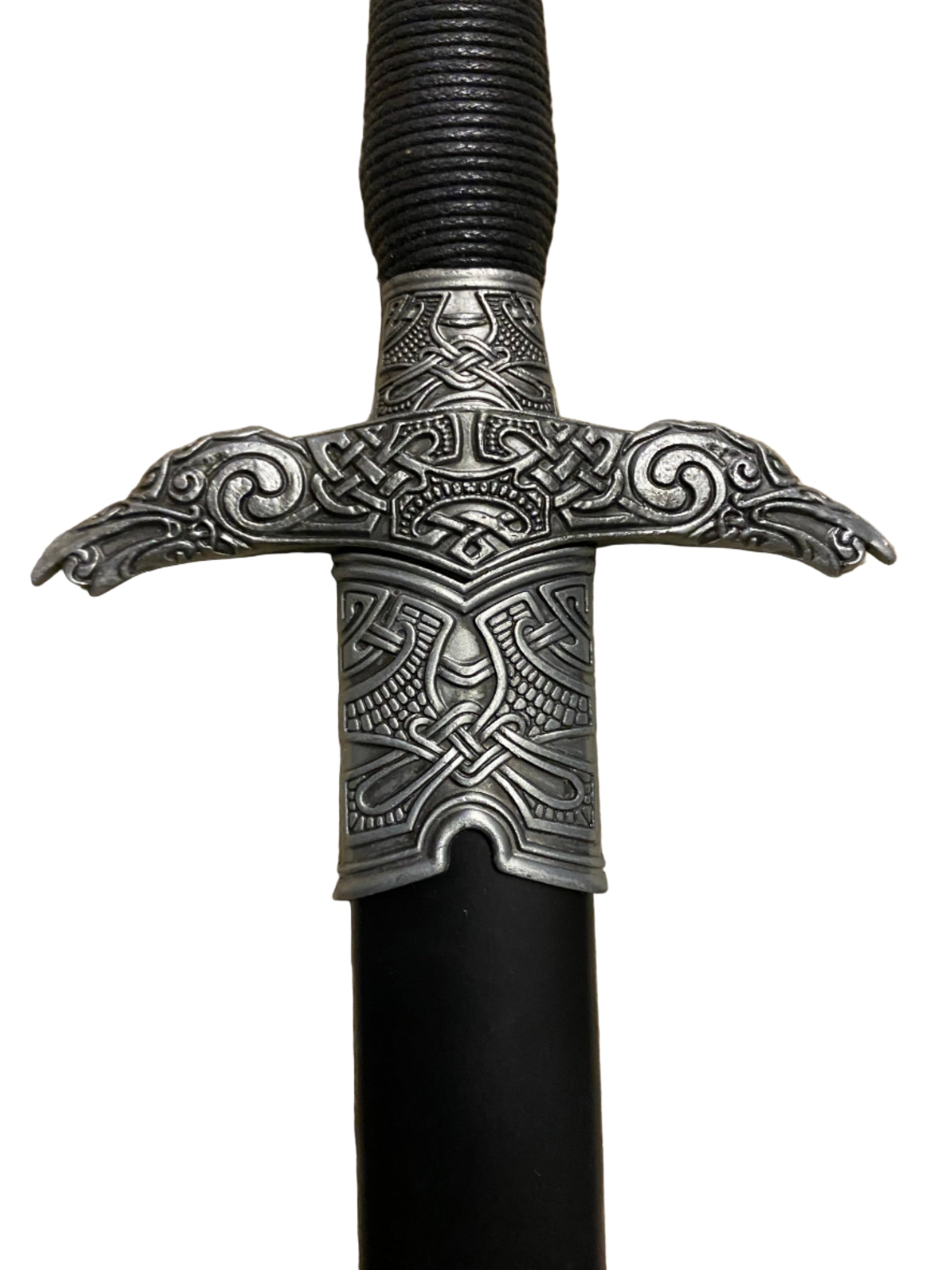 Decorative sword handle with intricate metalwork on a white background