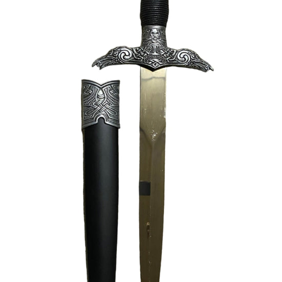Decorative dagger with sheath on a white background