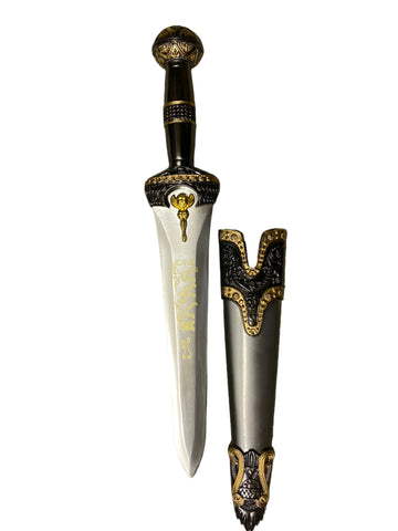 Decorative dagger with ornate handle and sheath on a white background