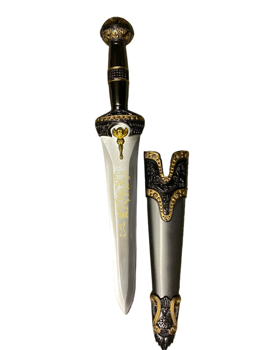 Decorative dagger with ornate handle and sheath on a white background