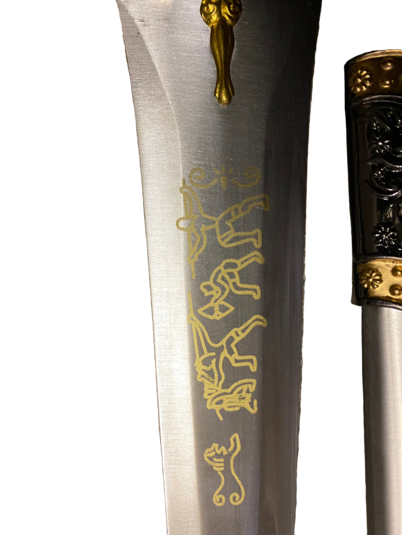 Decorative dagger with gold engravings on a white background