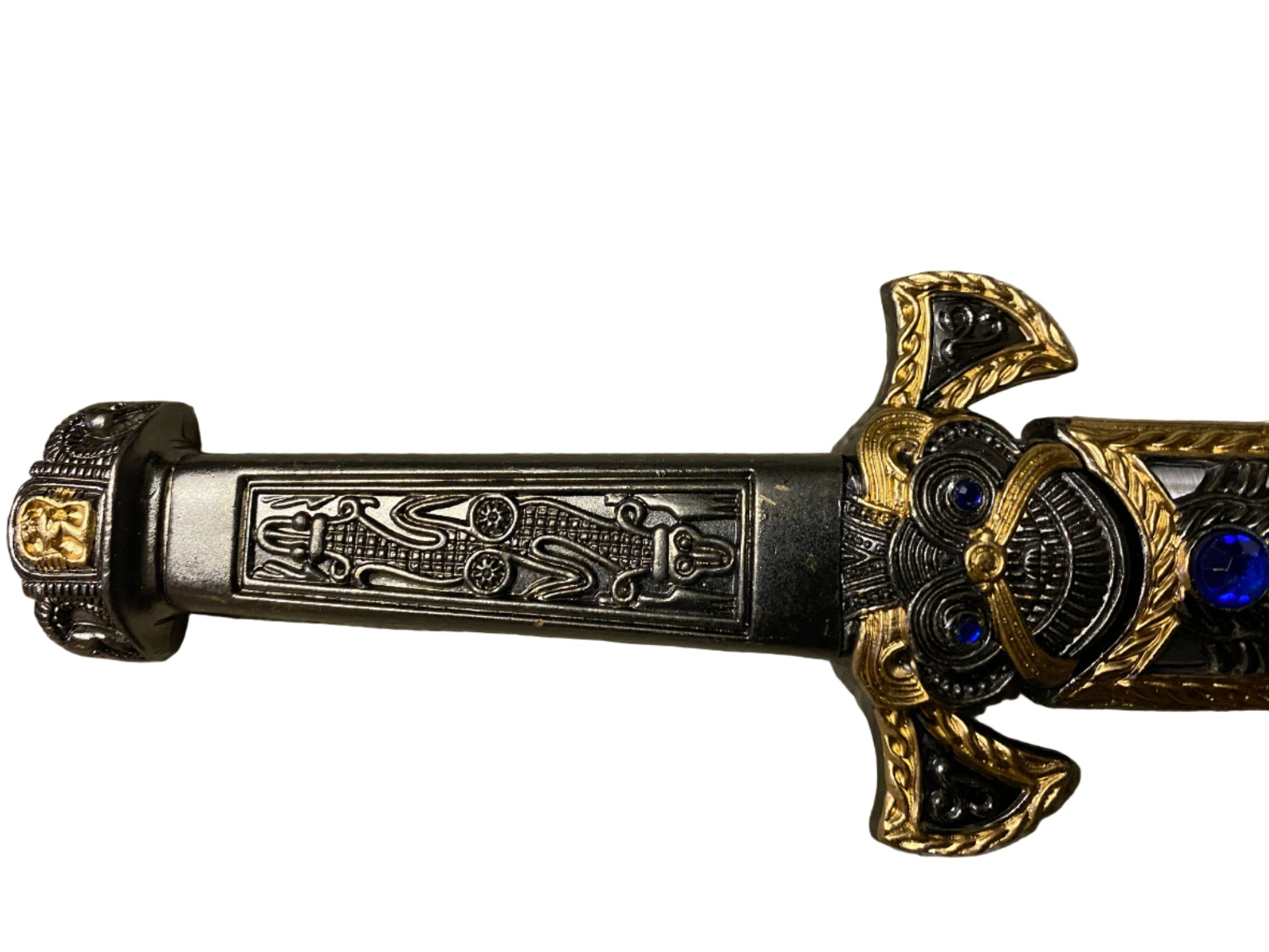 Decorative sword handle with intricate designs on a white background