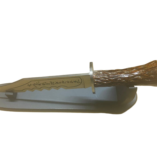 Knife with wooden handle and sheath on a white background