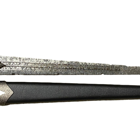 Decorative sword with a detailed blade on a white background