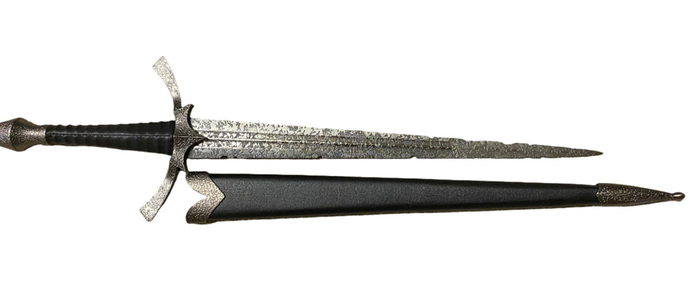 Decorative sword with a detailed blade on a white background