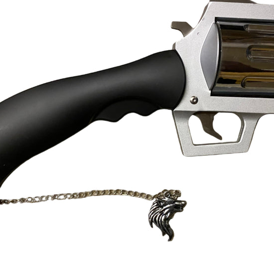 Black and silver revolver with a chain on a white background