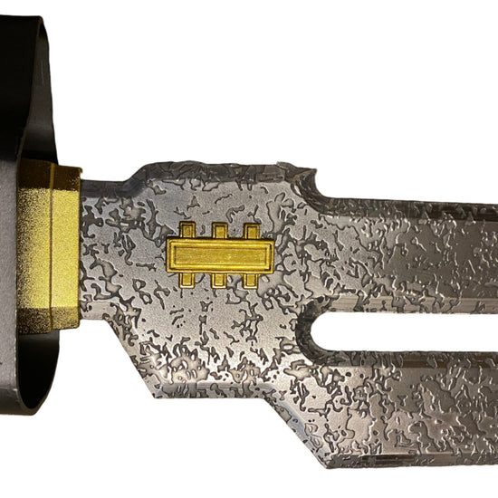 Close-up of a metallic object with intricate design on a white background