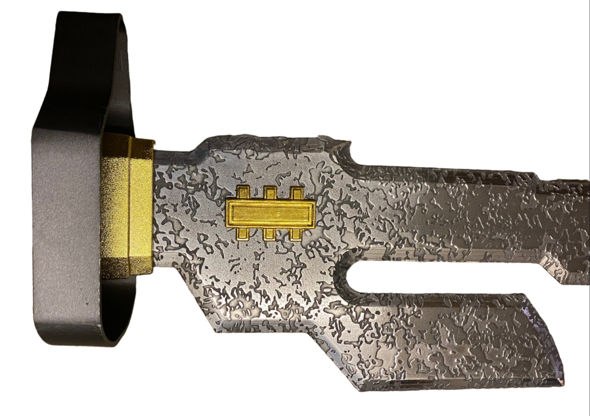 Close-up of a metallic object with intricate design on a white background