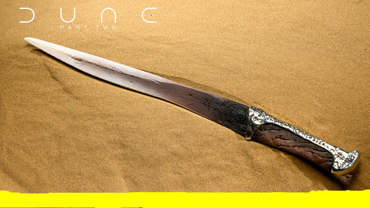 Decorative sword with intricate handle on a sand-like background, featuring 'Dune Part Two' text.