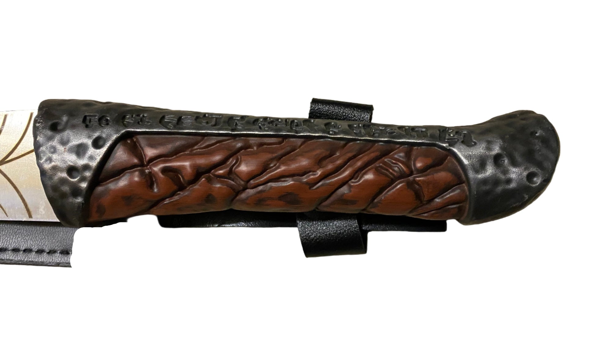 Wooden handle of a knife with metal accents on a white background